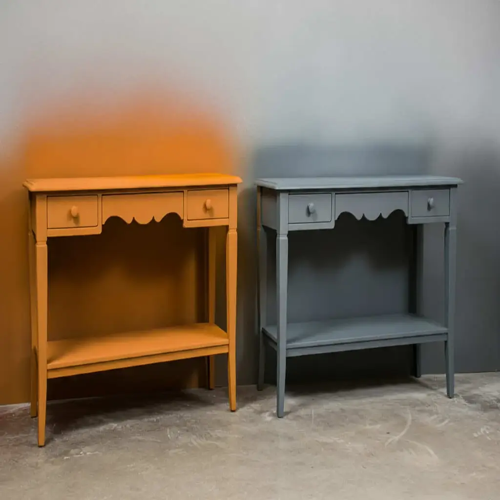 Furniture spray painter applying a smooth factory finish to cabinets and wooden units in a modern UK home